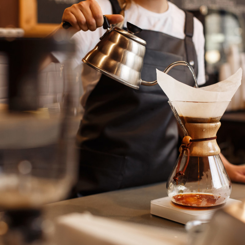 Professional,Barista,Preparing,Coffee,Using,Chemex,Pour,Over,Coffee,Maker